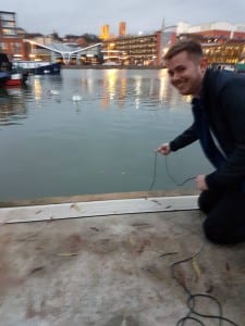 Me submerging the hydrophone in the Brayford, just before the ducks came to attack!